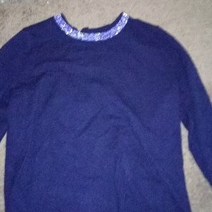 A blue sweater